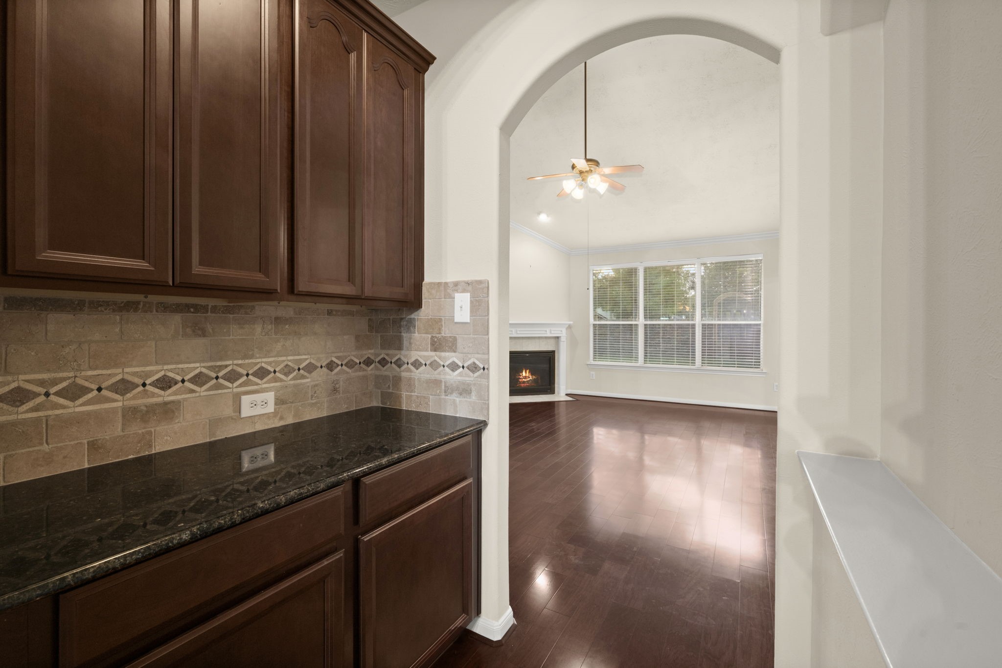 17411 Rainer Valley Lane Humble, TX 77346 - Photo 8 of 21 an empty room with wooden floor and cabinet