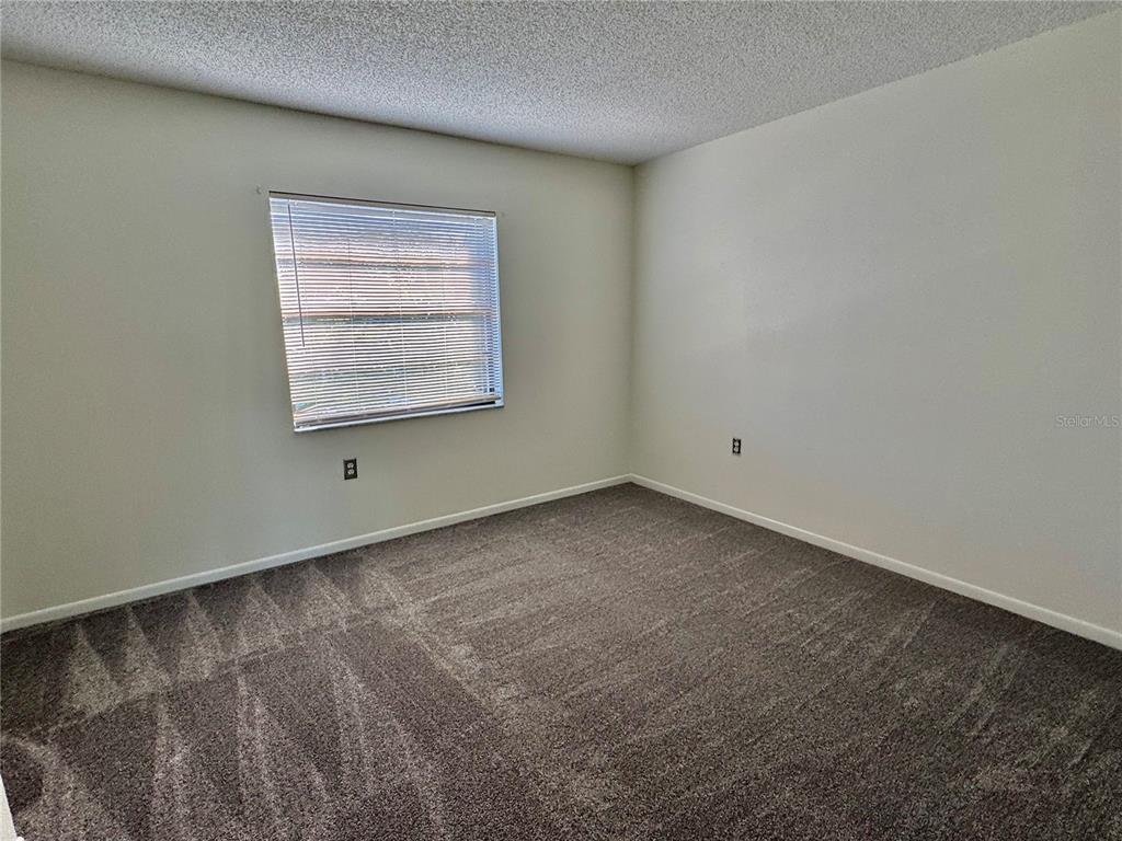 2131 Ridge Road South, Unit 105 Largo, FL 33778 - Photo 11 of 20 an empty room with a window