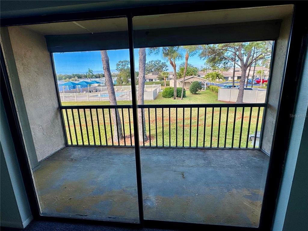 2131 Ridge Road South, Unit 105 Largo, FL 33778 - Photo 15 of 20 a view of a porch with a floor to ceiling window