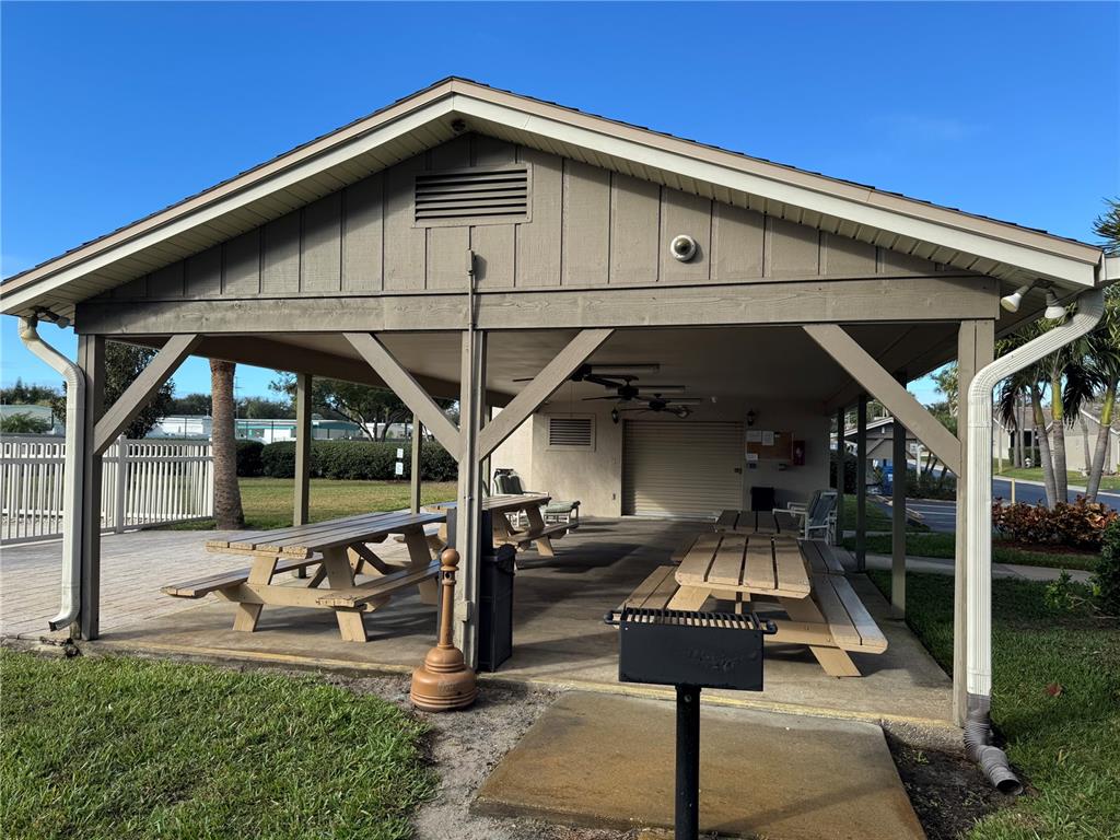 2131 Ridge Road South, Unit 105 Largo, FL 33778 - Photo 18 of 20 a front view of a house with parking
