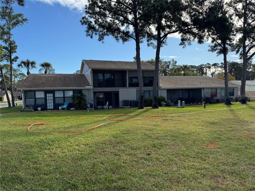 2131 Ridge Road South, Unit 105 Largo, FL 33778 - Photo 20 of 20 a view of a house with a yard
