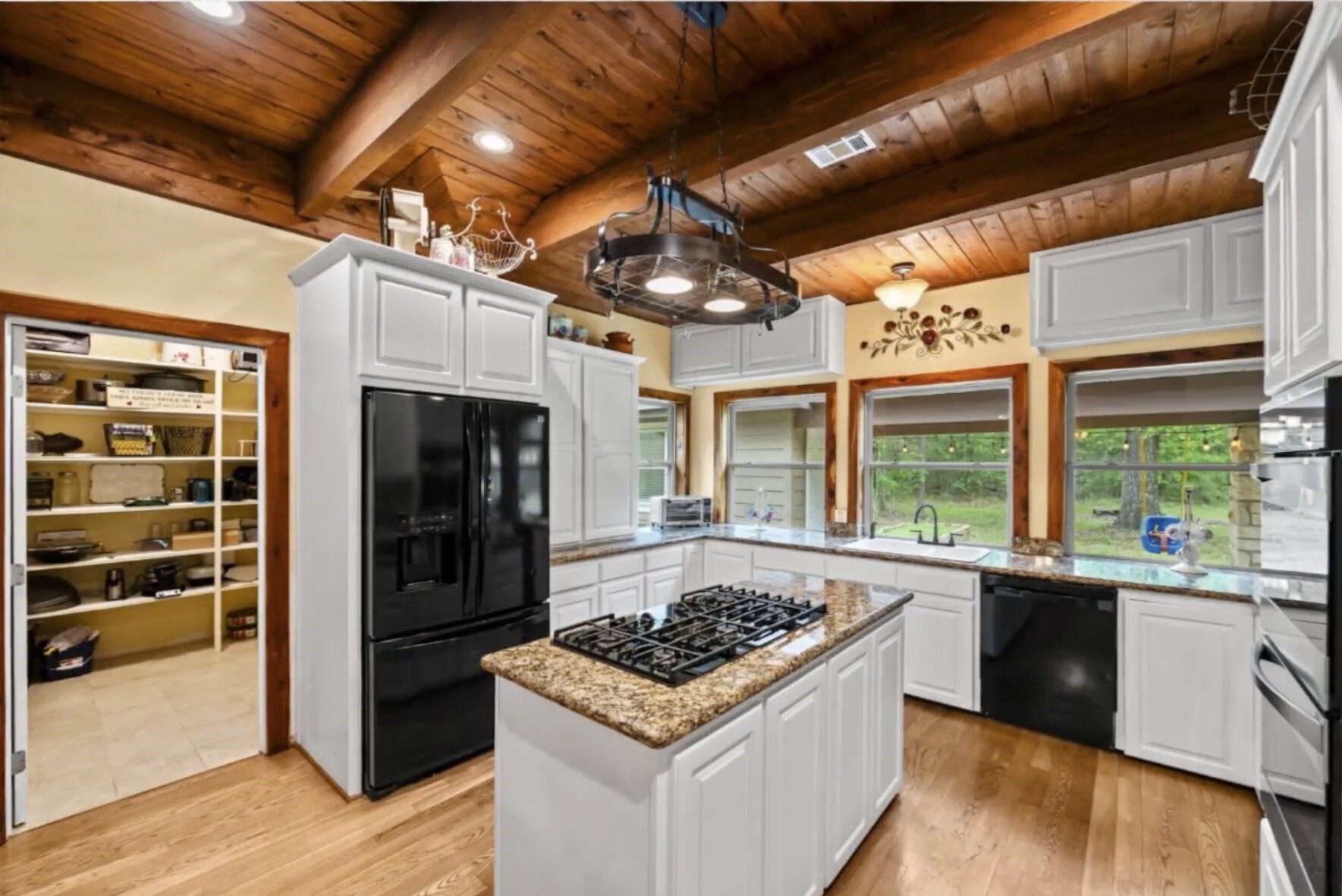 30338 Riley Road Waller, TX 77484 - Photo 11 of 46 a kitchen with a stove and a refrigerator