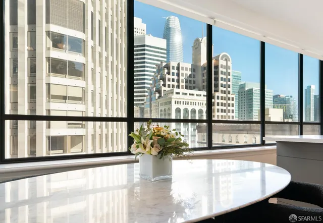 a kitchen with stainless steel appliances a sink and a large window
