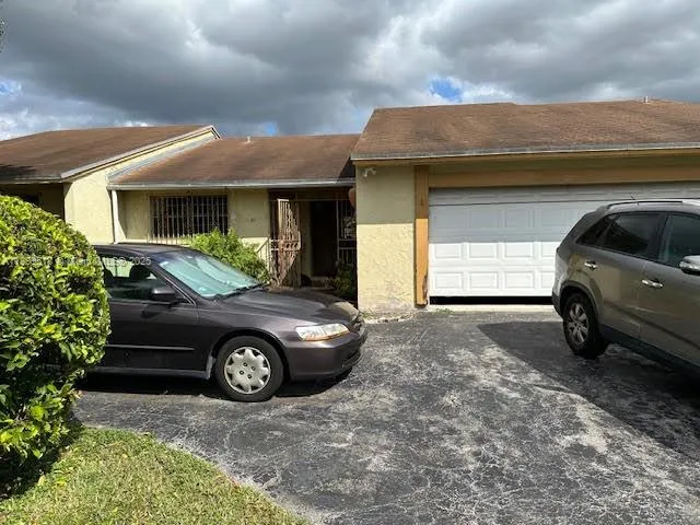 a car parked in front of a house