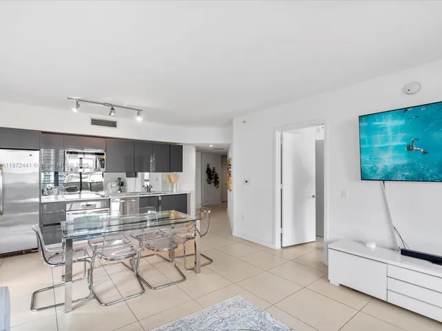 a living room with fireplace furniture and a flat screen tv