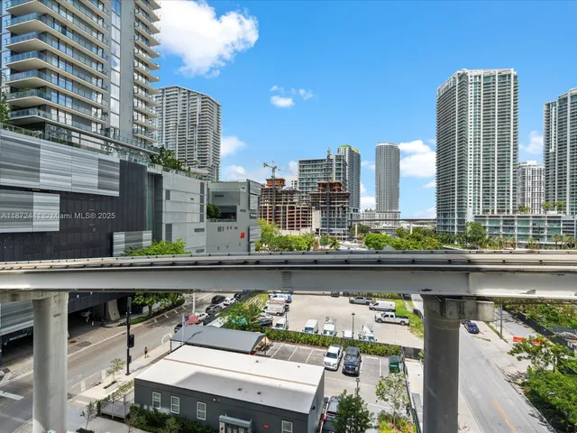a view of city and a tall buildings