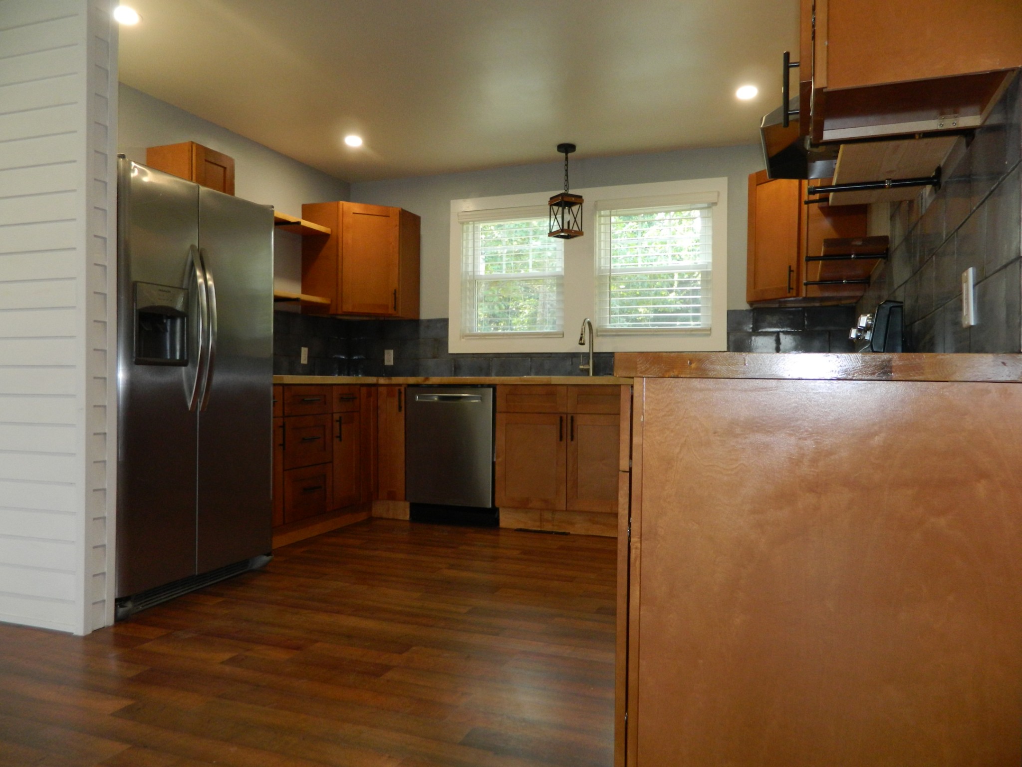 1276 Gip Manning Road Clarksville, TN 37042 - Photo 5 of 15 a kitchen with stainless steel appliances a refrigerator and a sink
