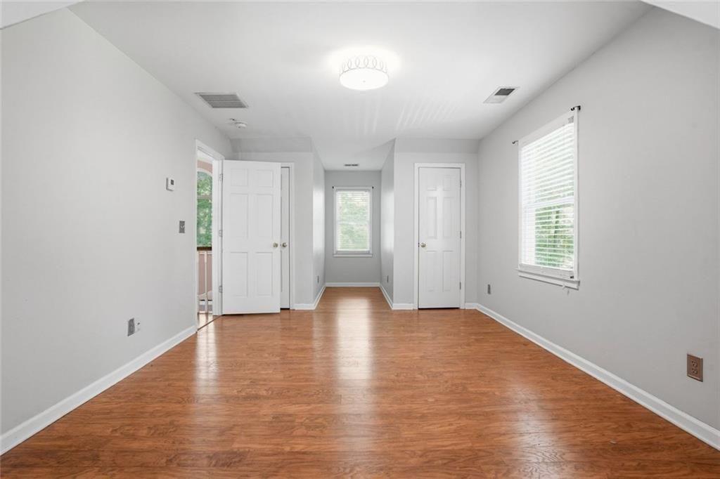 3259 Etchison Road Loganville, GA 30052 - Photo 26 of 50 a view of an empty room with wooden floor and a window