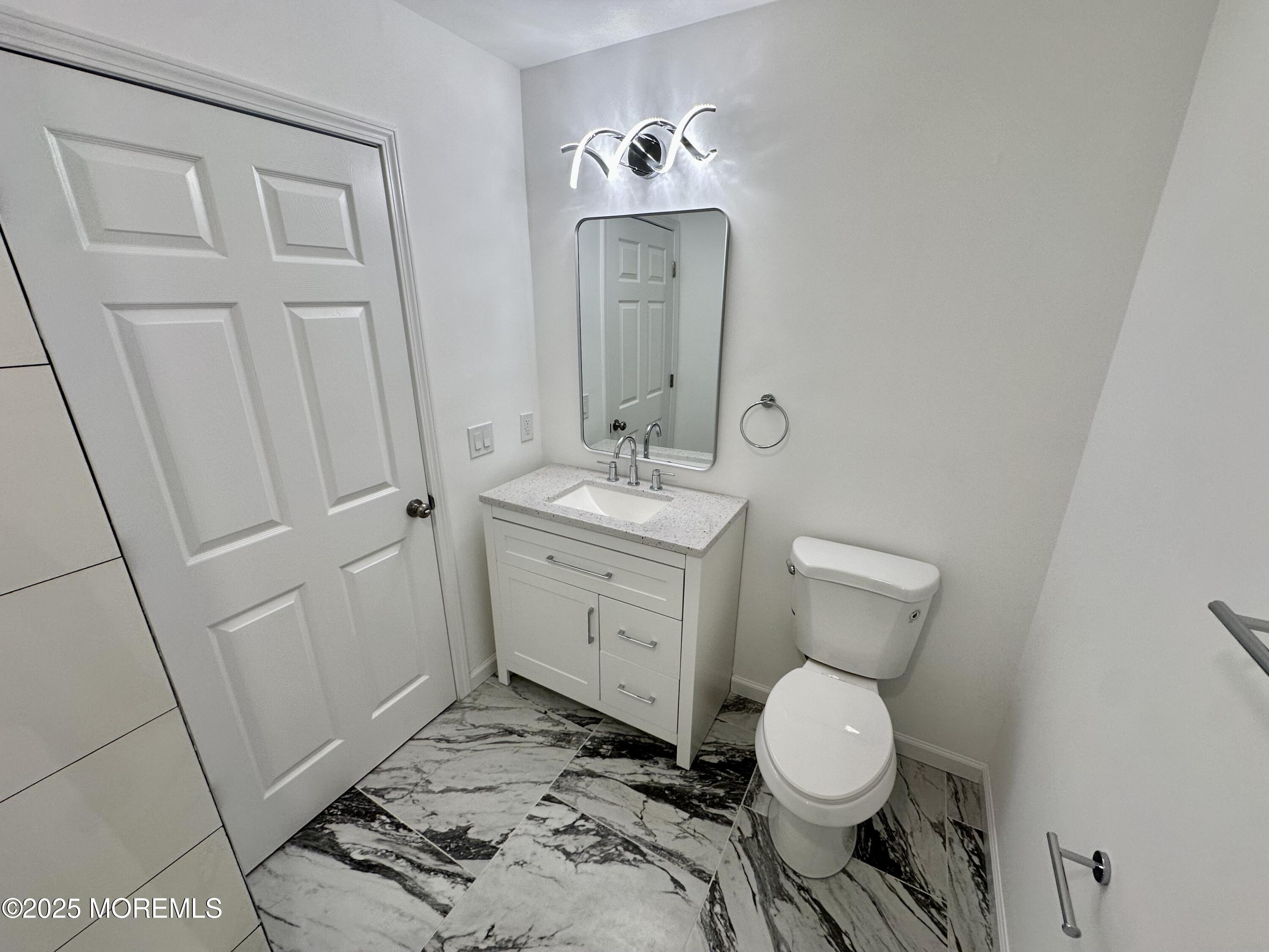 51 Picket Place Freehold, NJ 07728 - Photo 24 of 47 a bathroom with a toilet sink and mirror