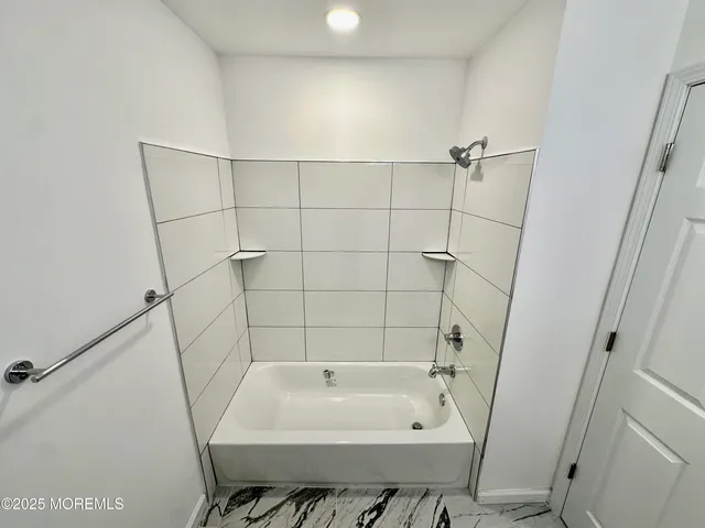 a bathroom with a sink and a tub