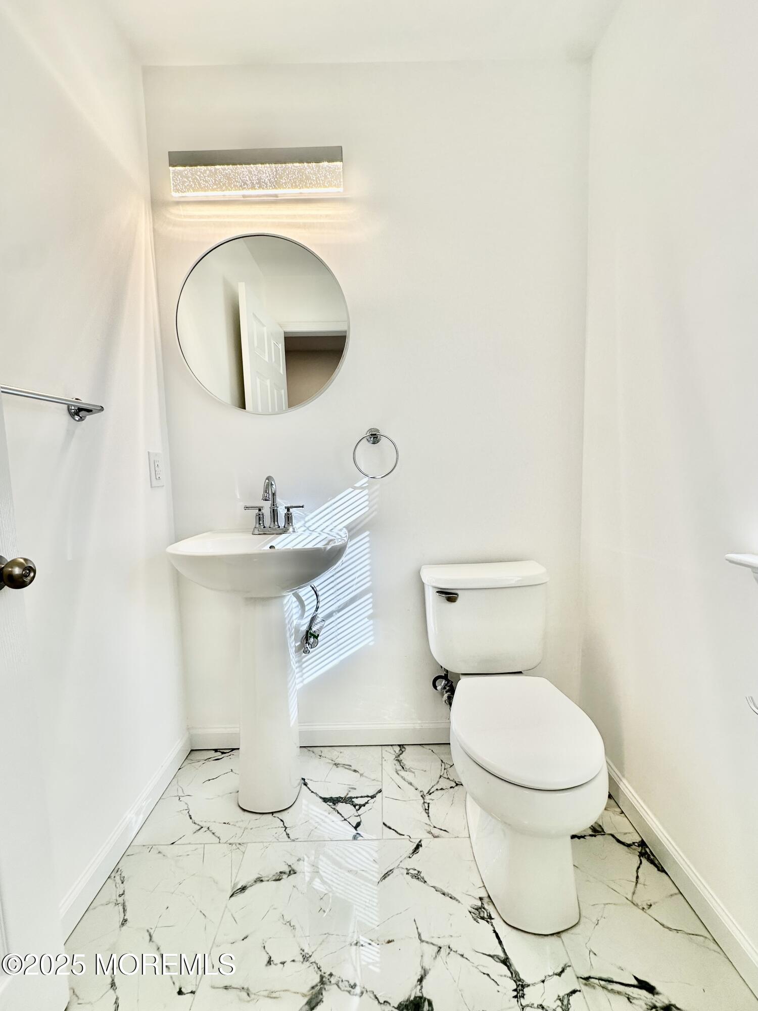 51 Picket Place Freehold, NJ 07728 - Photo 3 of 47 a white toilet sitting next to a bathroom sink