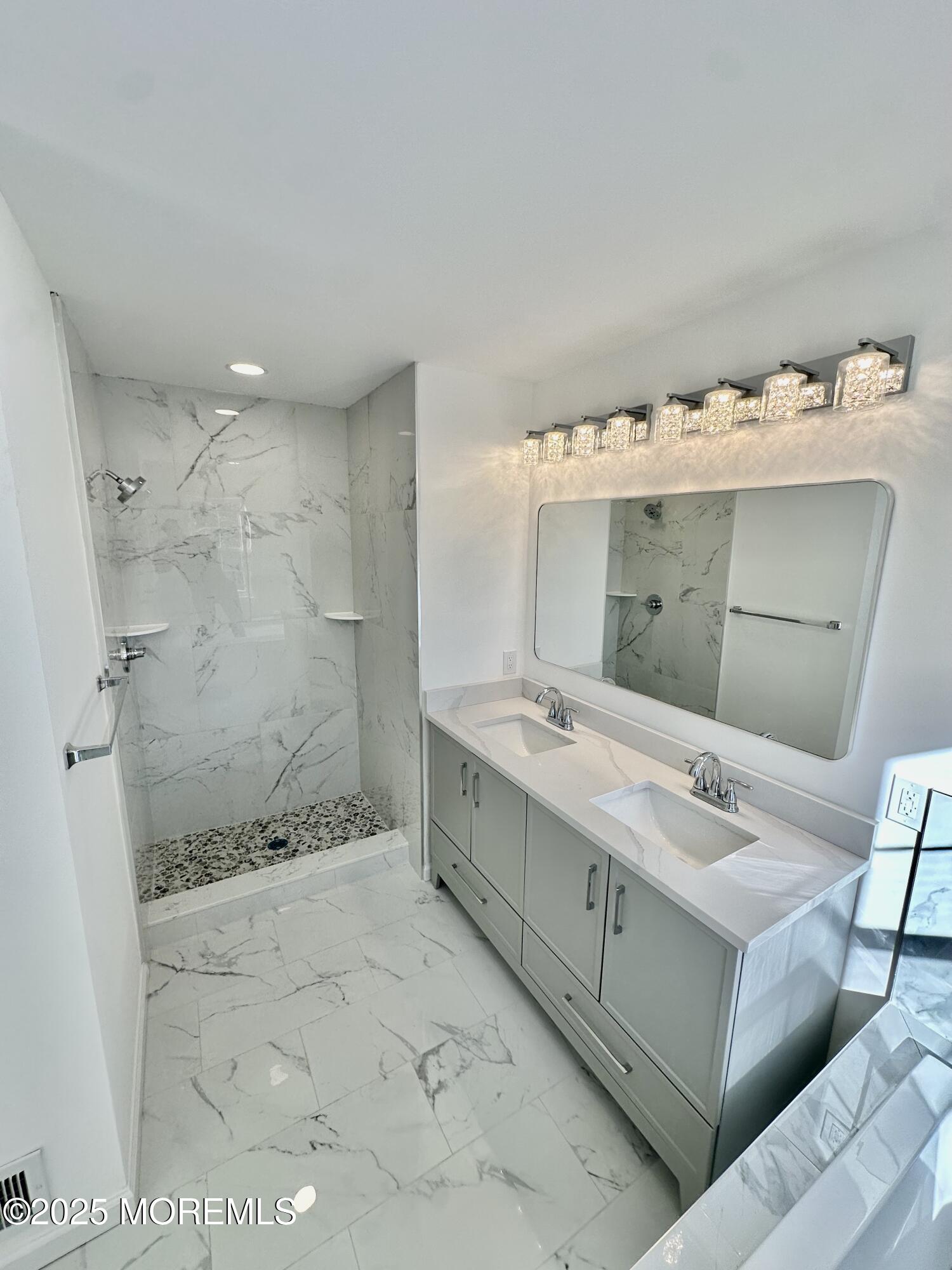 51 Picket Place Freehold, NJ 07728 - Photo 38 of 47 a bathroom with a double vanity sink toilet and shower