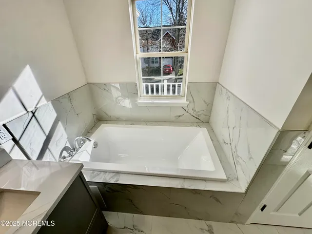 a bathroom with a sink and a bathtub