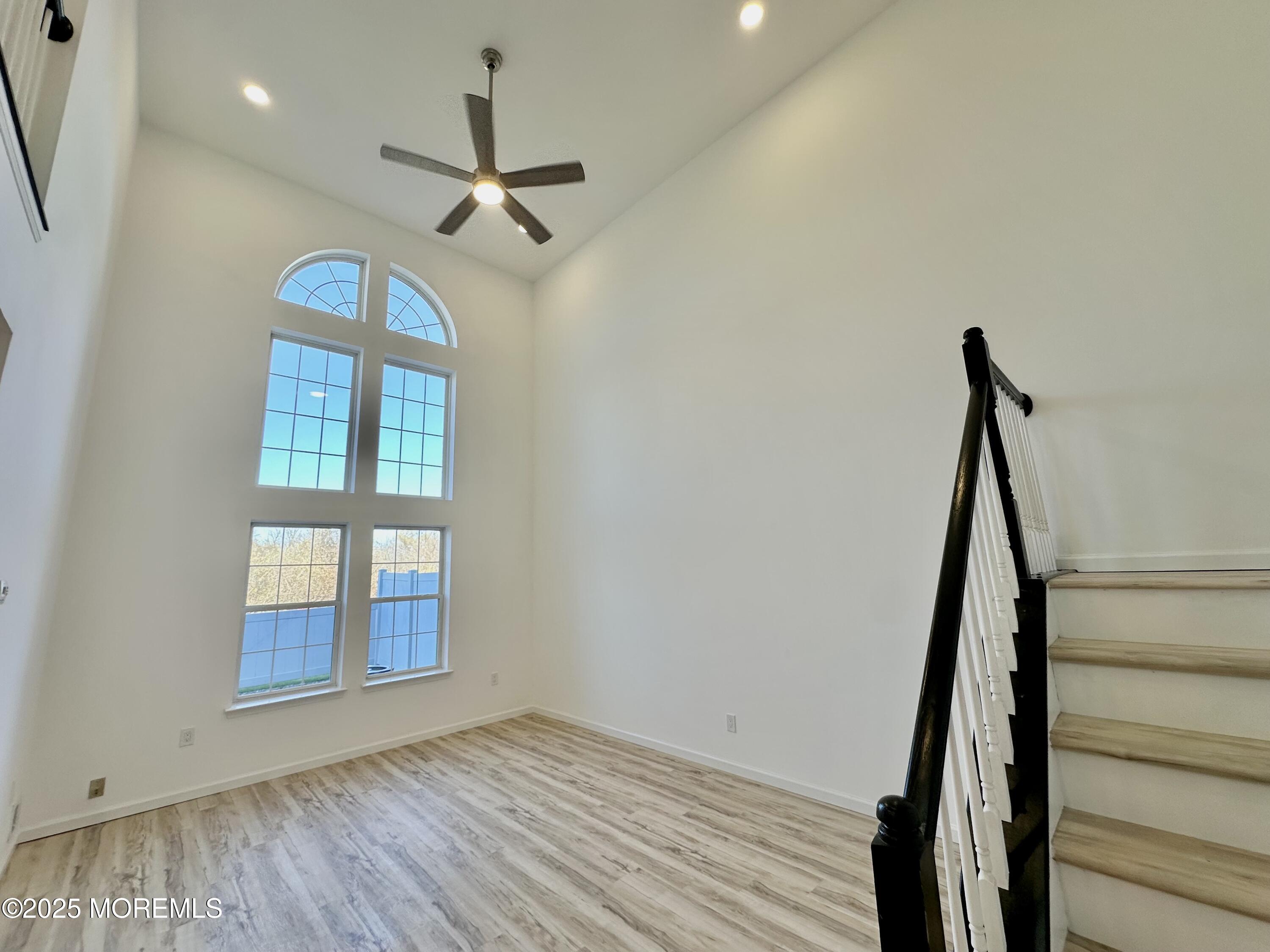51 Picket Place Freehold, NJ 07728 - Photo 4 of 47 a view of empty room with wooden floor and fan