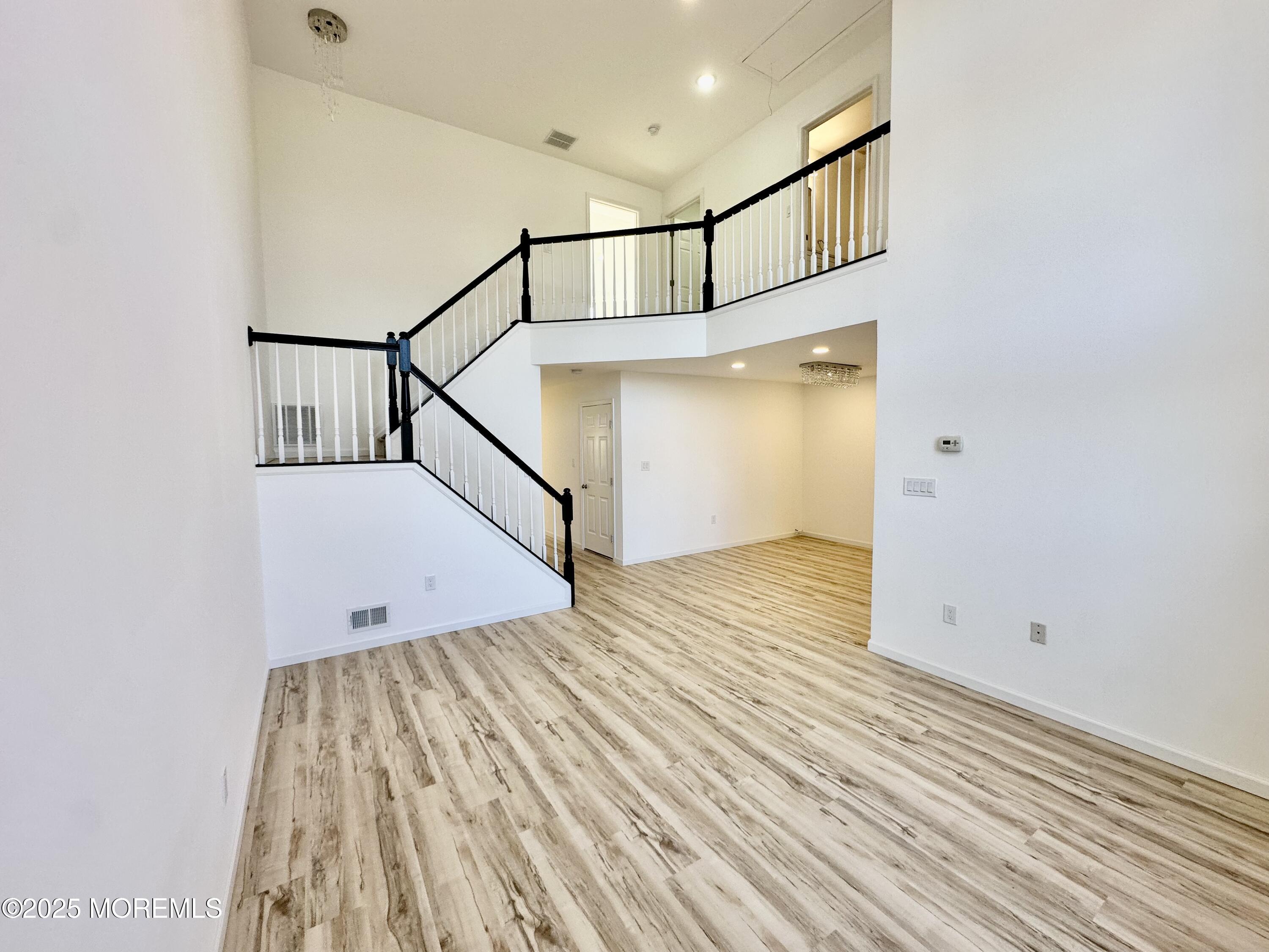 51 Picket Place Freehold, NJ 07728 - Photo 6 of 47 a view of entryway with wooden floor