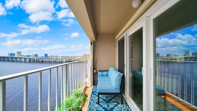 a view of balcony with furniture