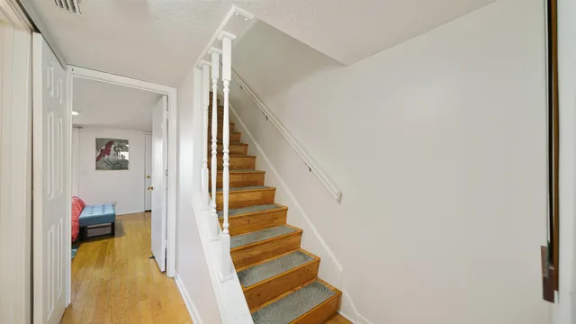 a view of a city with lawn chairs and a fire pit