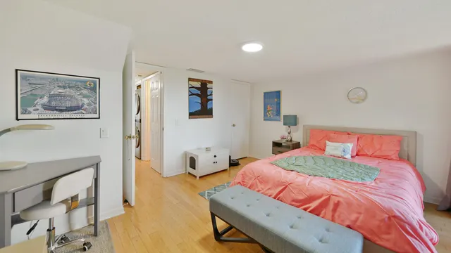 a bedroom with a bed and a dresser