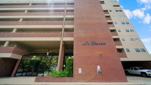 a living room with furniture and flowers