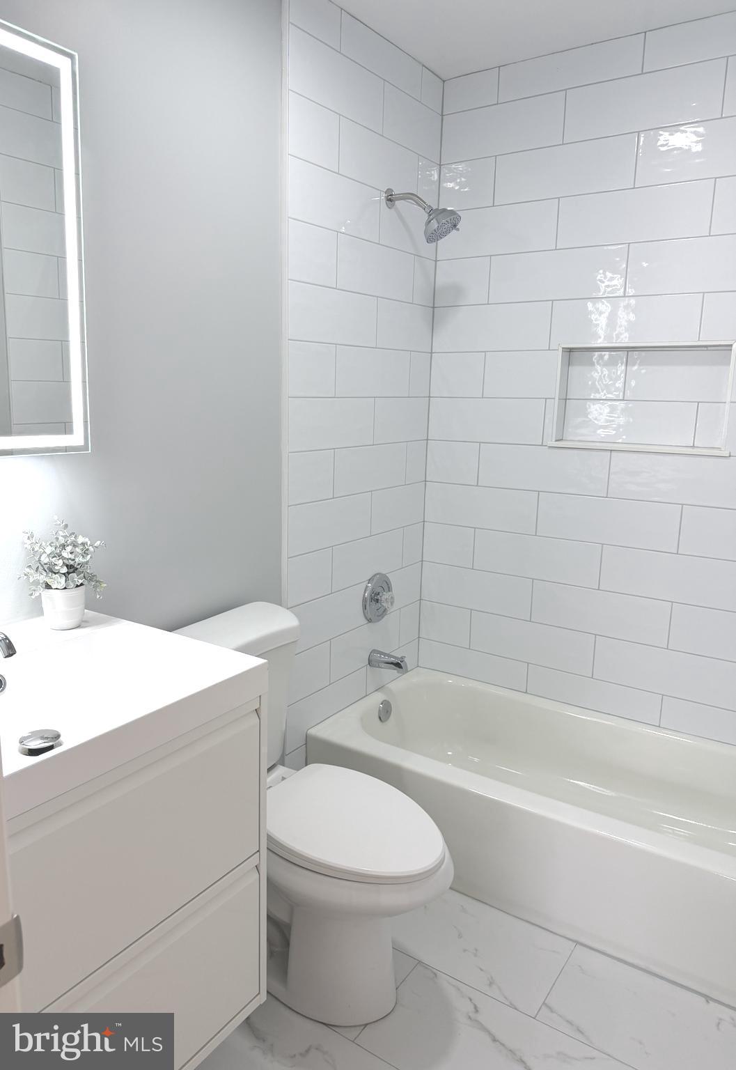 580 Park Road Severna Park, MD 21146 - Photo 17 of 36 a bathroom with a sink a toilet and shower