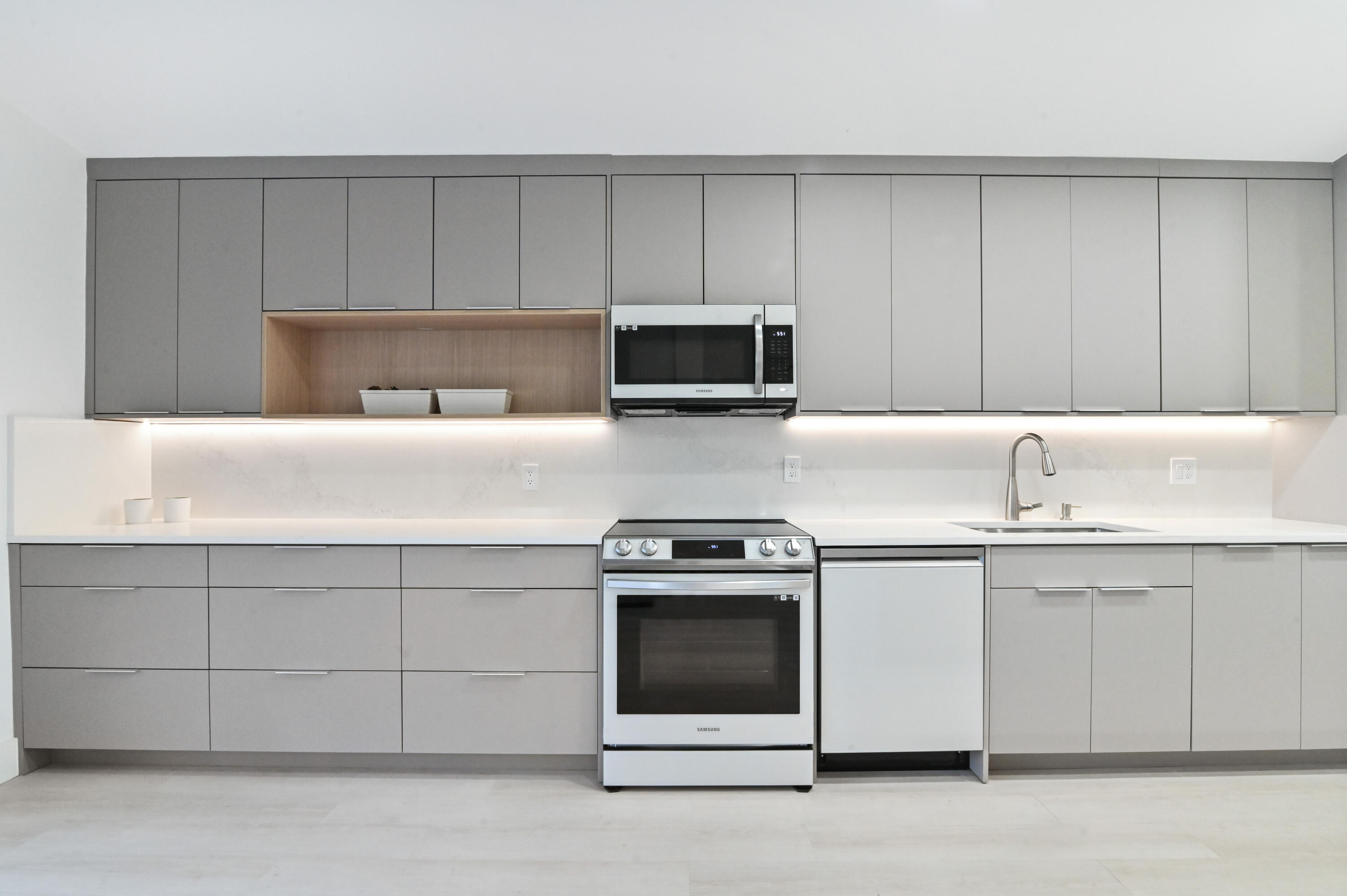 11294 Cloverleaf Circle Boca Raton, FL 33428 - Photo 11 of 81 a kitchen with granite countertop white cabinets and stainless steel appliances