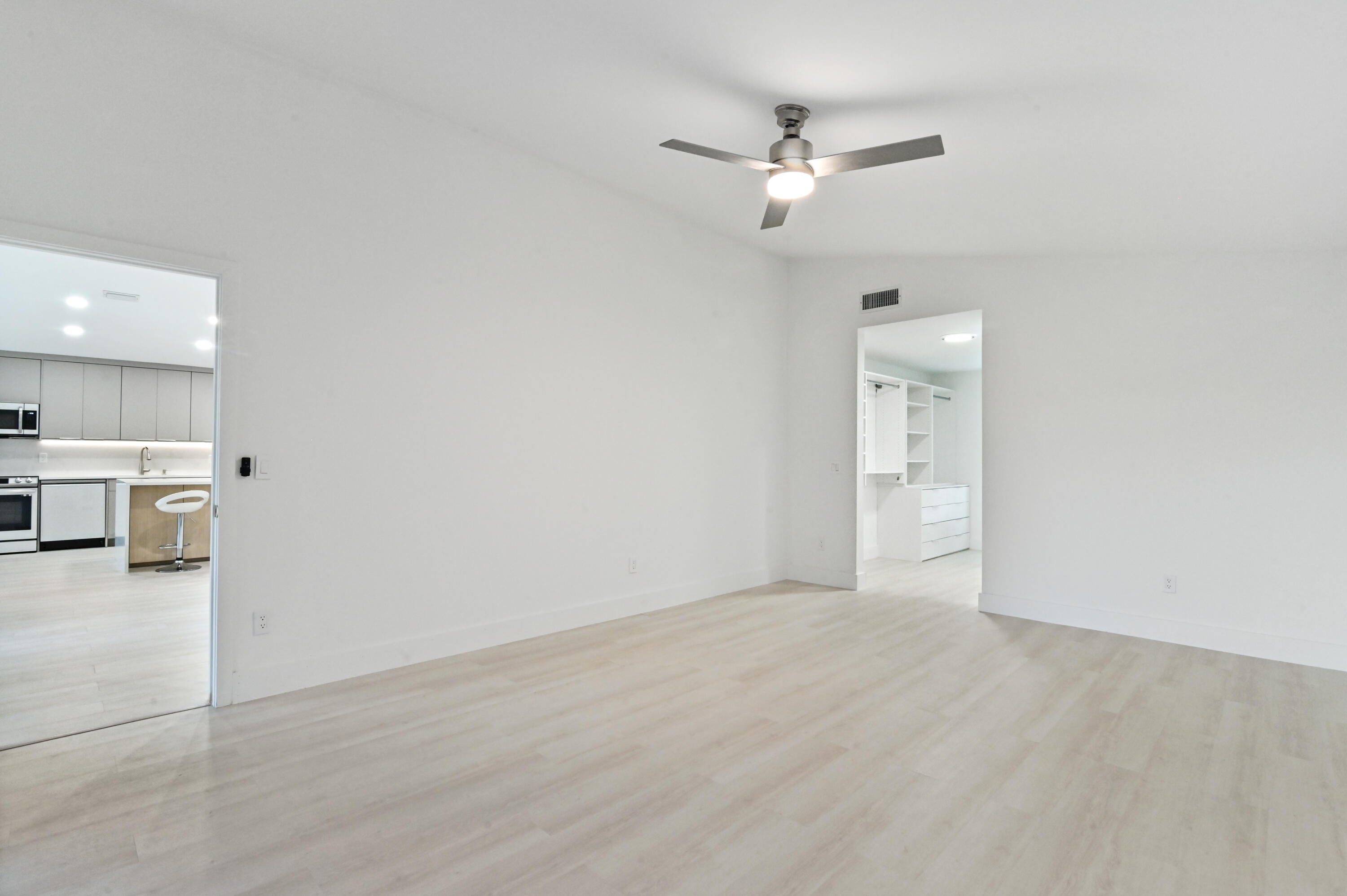 11294 Cloverleaf Circle Boca Raton, FL 33428 - Photo 24 of 81 a view of a hallway with a kitchen