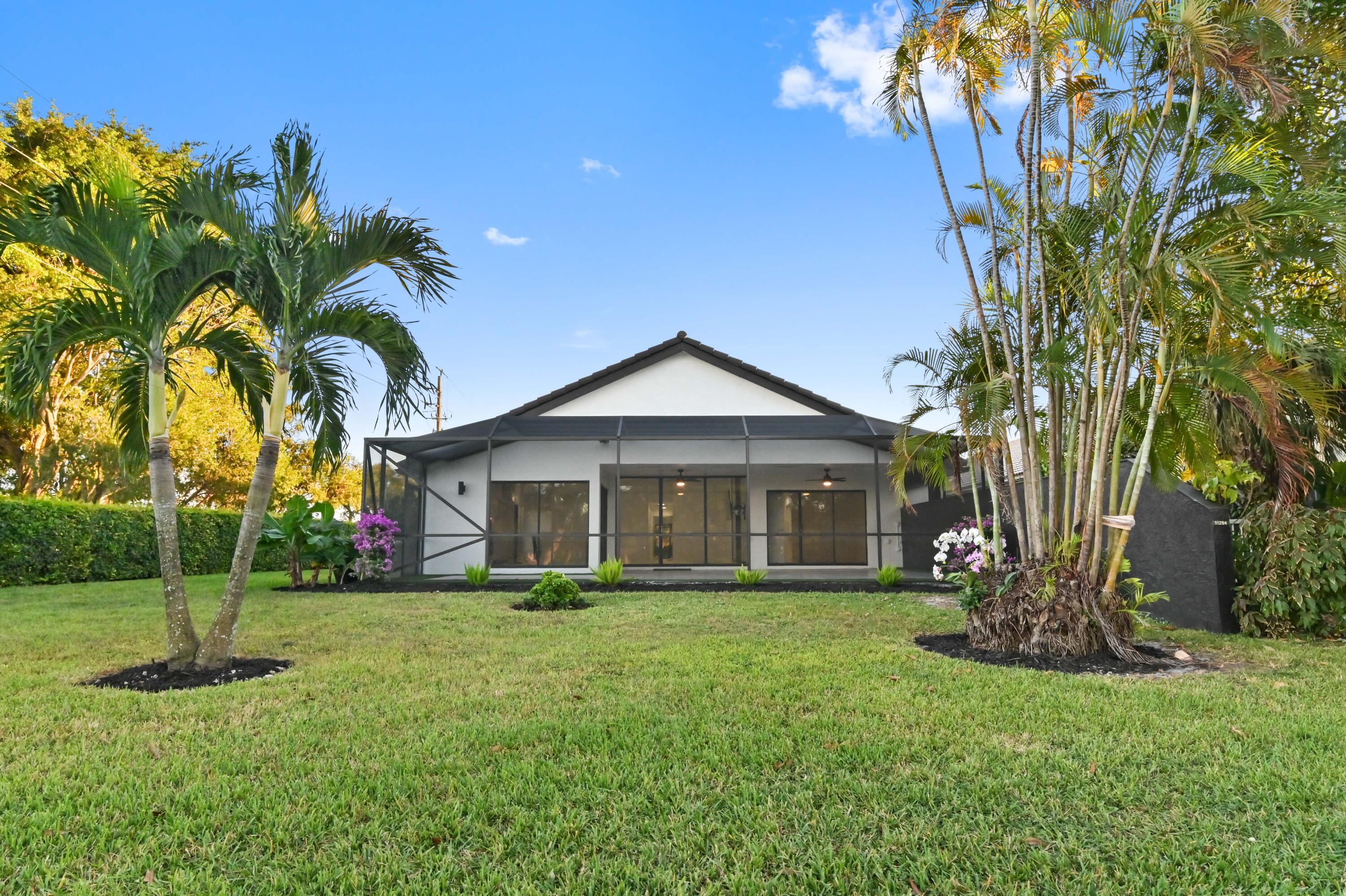 11294 Cloverleaf Circle Boca Raton, FL 33428 - Photo 41 of 81 a front view of house with yard and green space