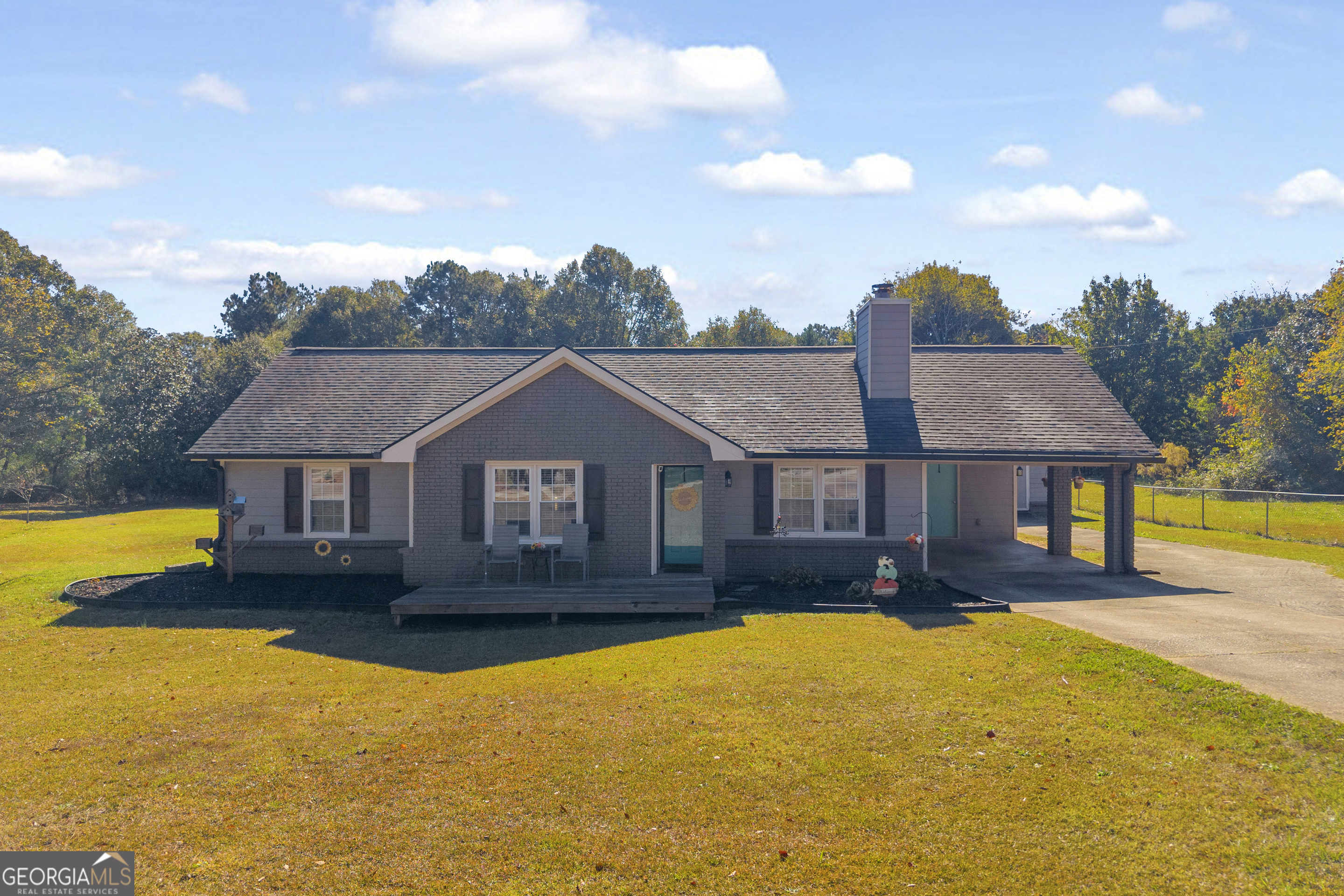 809 Parker Court Monroe, GA 30656 - Photo 1 of 55 a front view of a house with swimming pool