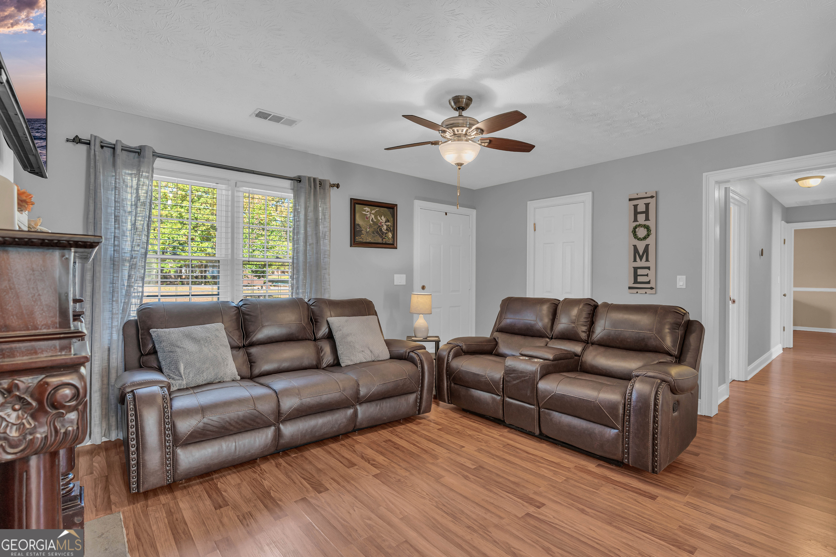 809 Parker Court Monroe, GA 30656 - Photo 11 of 55 a living room with furniture and a large window