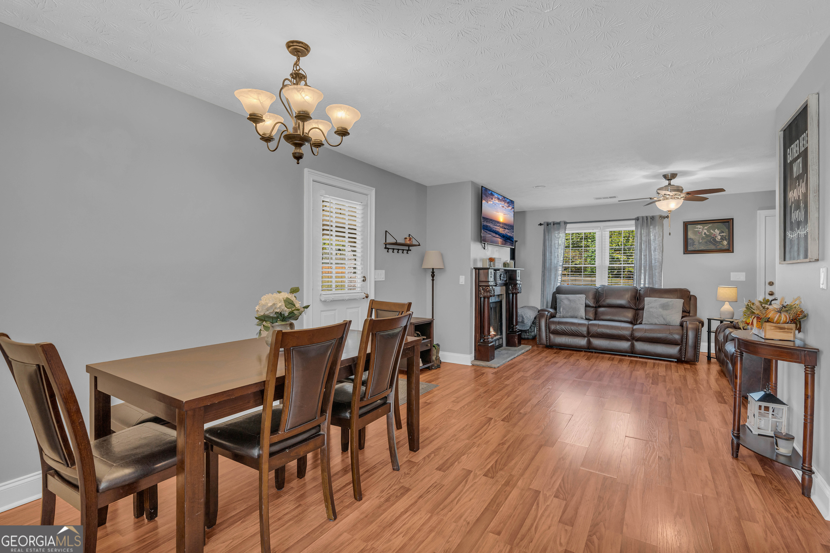 809 Parker Court Monroe, GA 30656 - Photo 15 of 55 a view of a dining room with furniture and wooden floor