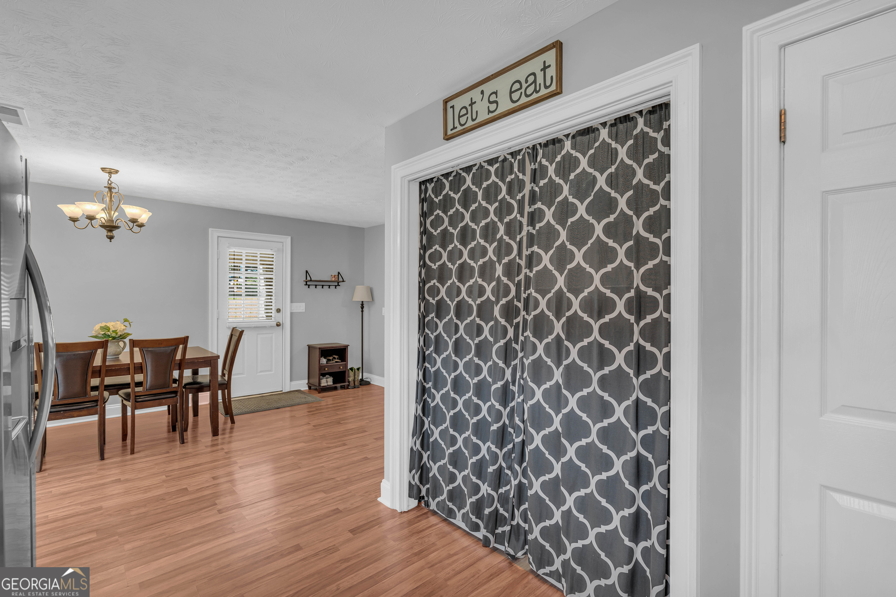 809 Parker Court Monroe, GA 30656 - Photo 17 of 55 a view of a livingroom with furniture and wooden floor