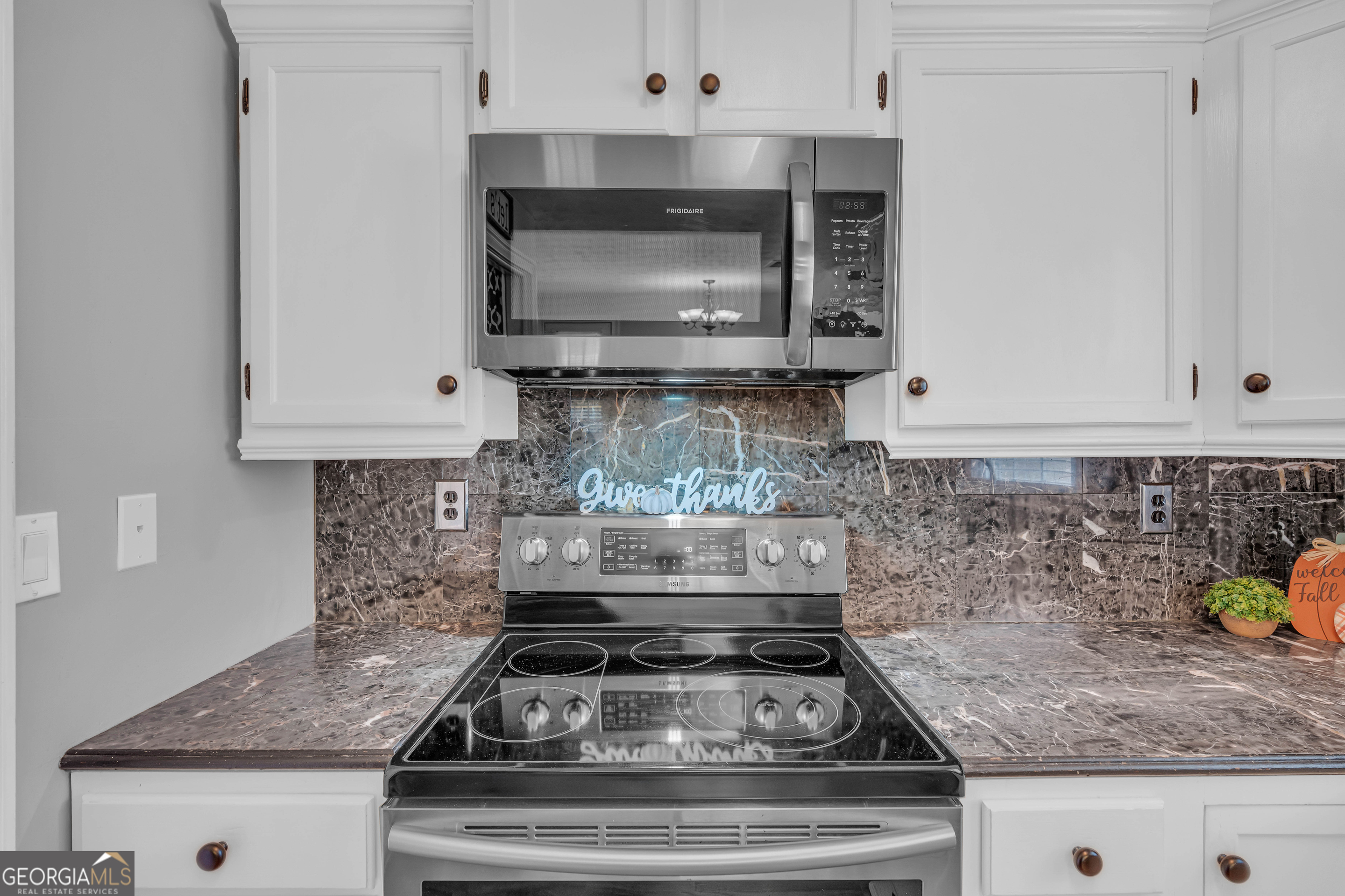 809 Parker Court Monroe, GA 30656 - Photo 19 of 55 a stove top oven sitting inside of a kitchen