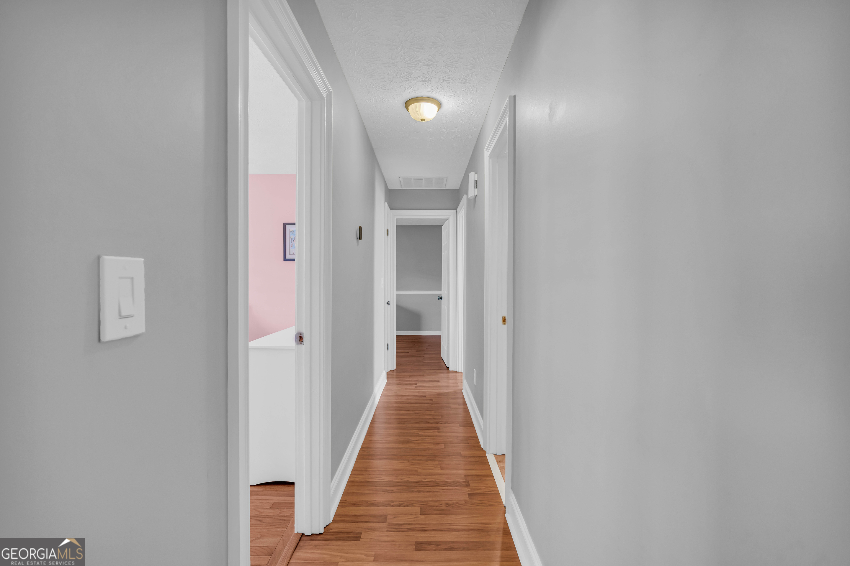 809 Parker Court Monroe, GA 30656 - Photo 29 of 55 a view of a hallway with wooden floor