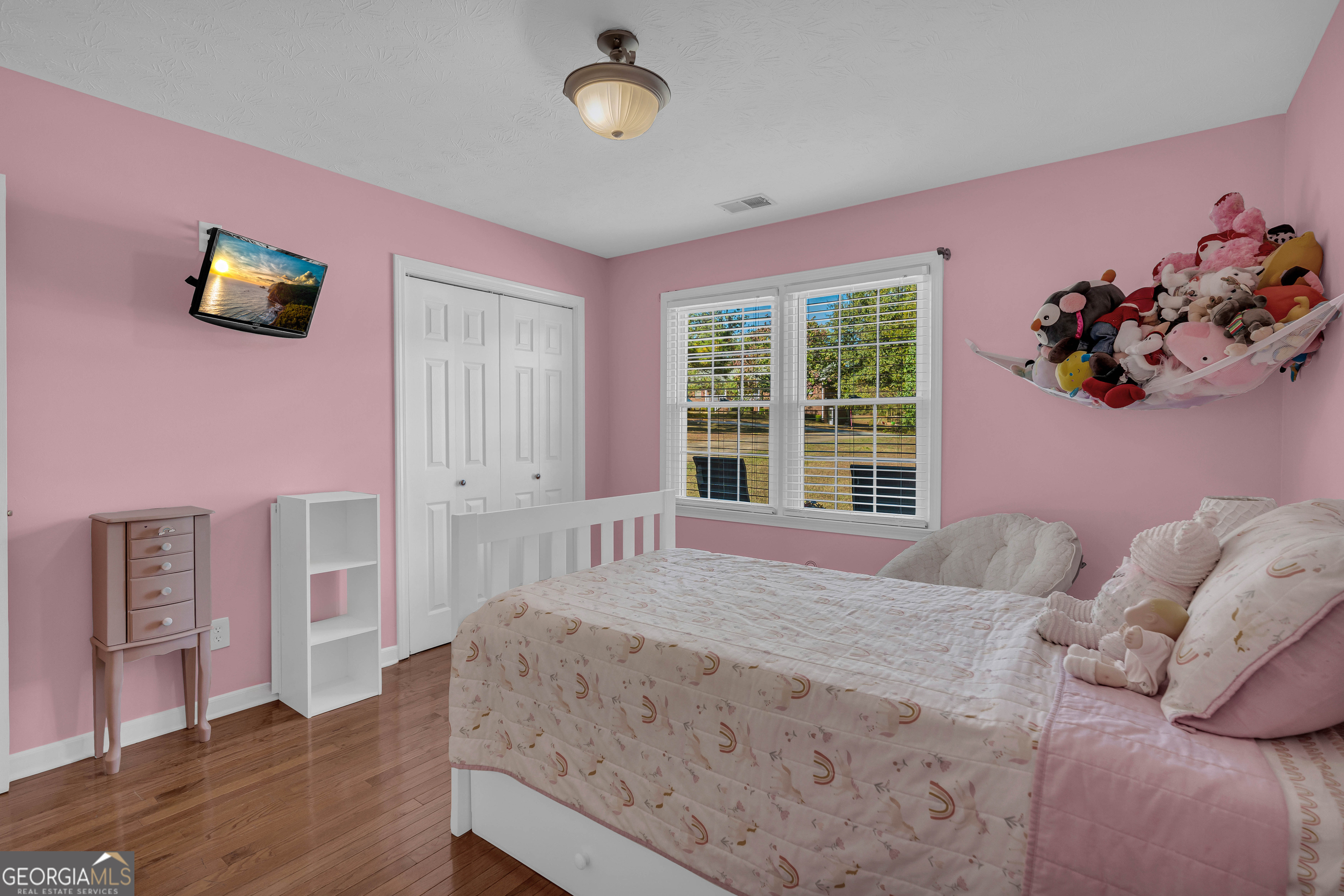 809 Parker Court Monroe, GA 30656 - Photo 38 of 55 a bedroom with a bed and a window