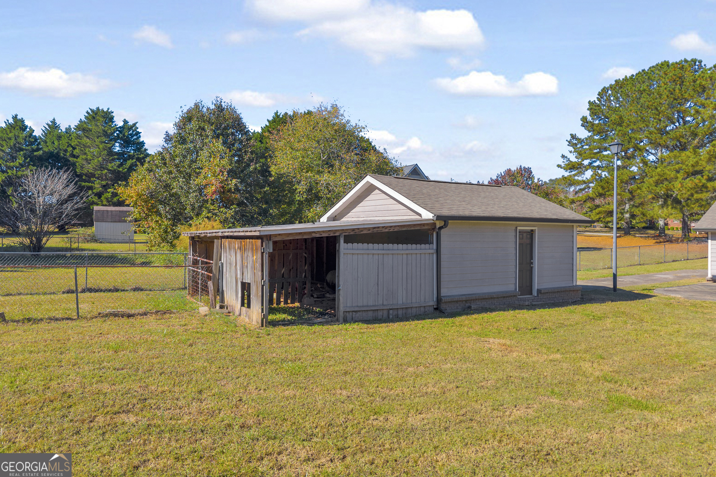 809 Parker Court Monroe, GA 30656 - Photo 41 of 55 a view of a house with a yard