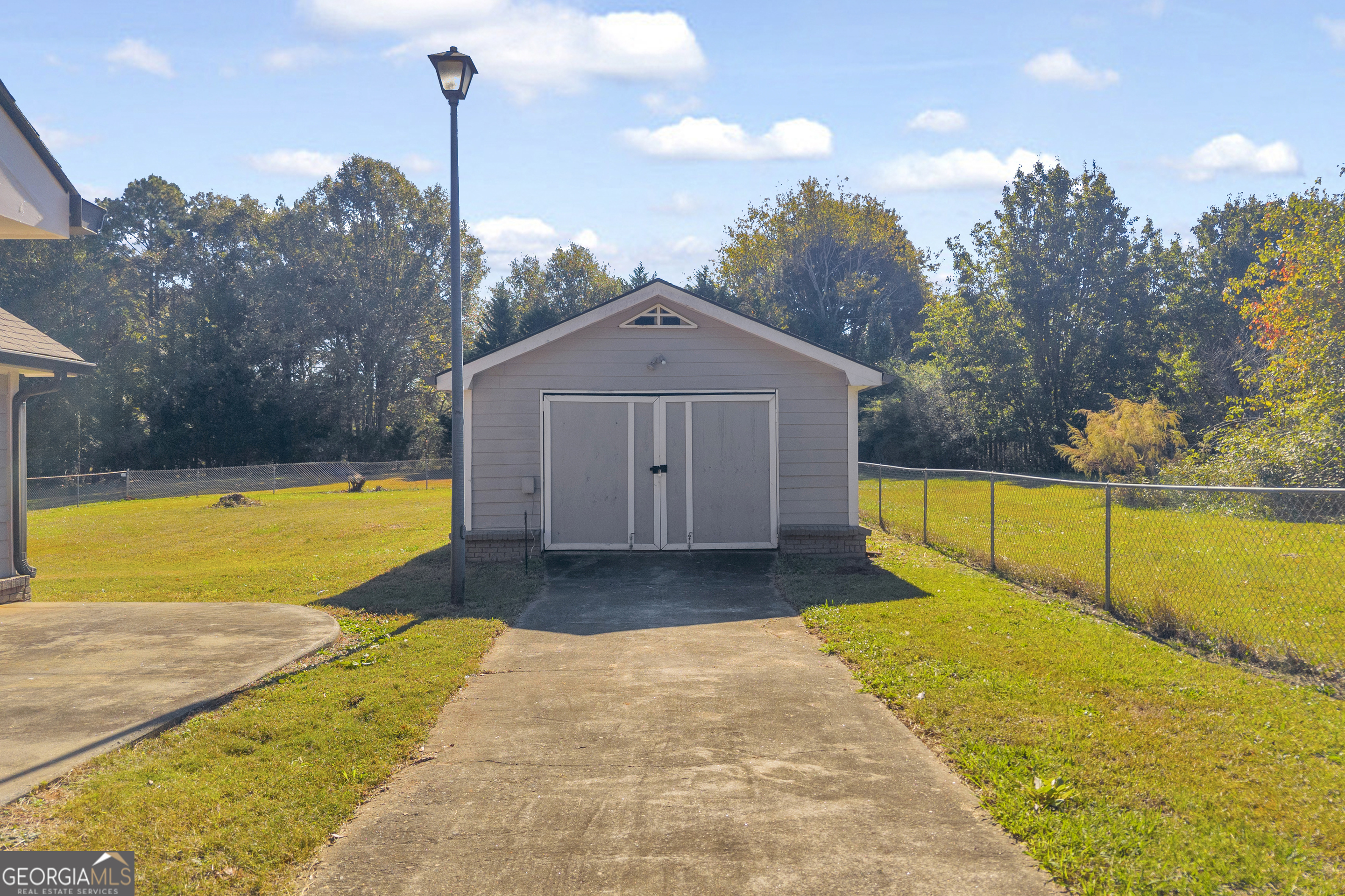 809 Parker Court Monroe, GA 30656 - Photo 5 of 55 a view of swimming pool with trees in the background