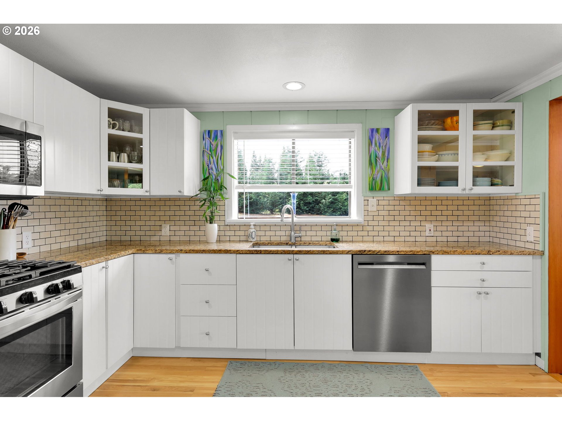 35478 Brabham Road Pleasant Hill, OR 97455 - Photo 11 of 48 a kitchen with stainless steel appliances granite countertop a stove a sink and a microwave