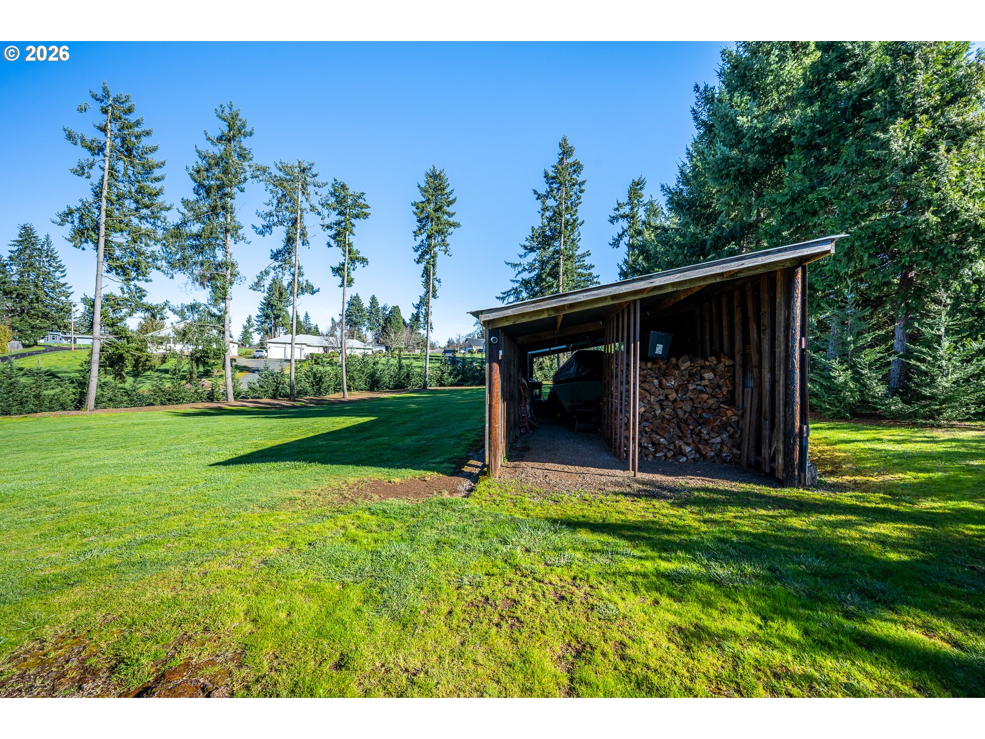 35478 Brabham Road Pleasant Hill, OR 97455 - Photo 41 of 48 a view of a backyard with table and chairs and garden