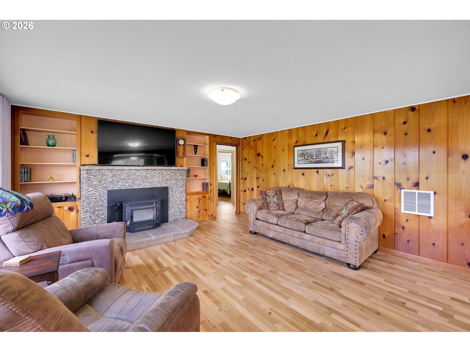35478 Brabham Road Pleasant Hill, OR 97455 - Photo 5 of 48 a living room with furniture a flat screen tv and a fireplace
