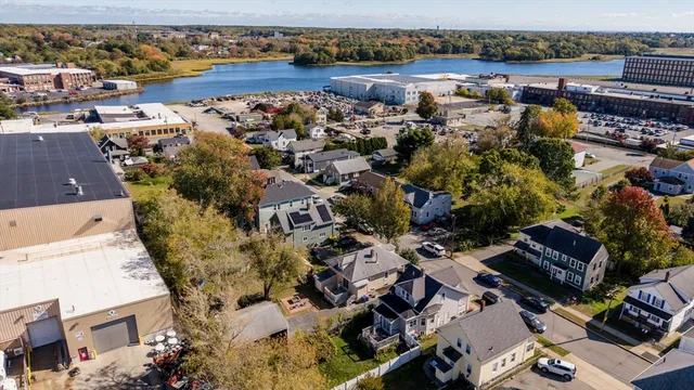 an aerial view of a house with a lake view