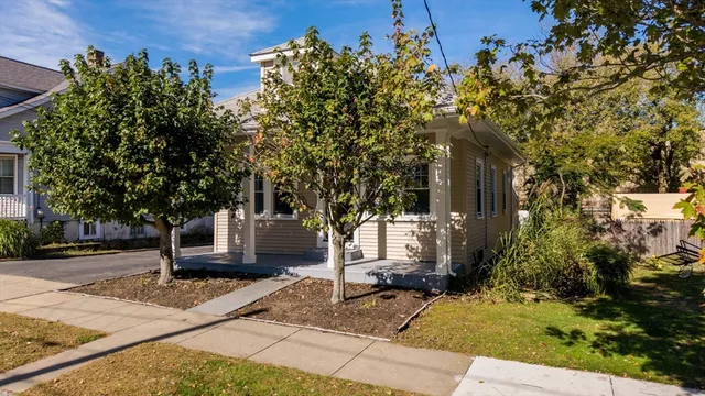 a view of a house with a tree