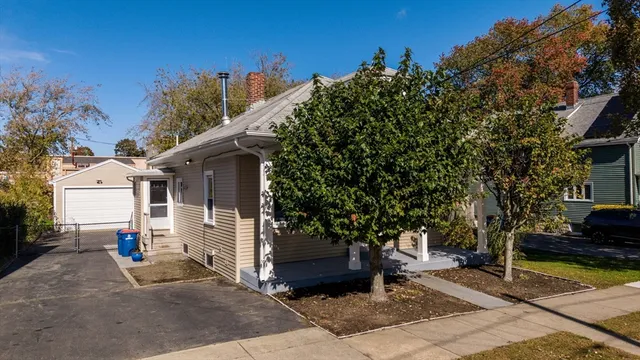a view of a house with a backyard