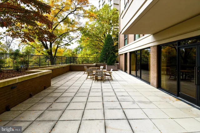 a view of a chairs and table in the patio