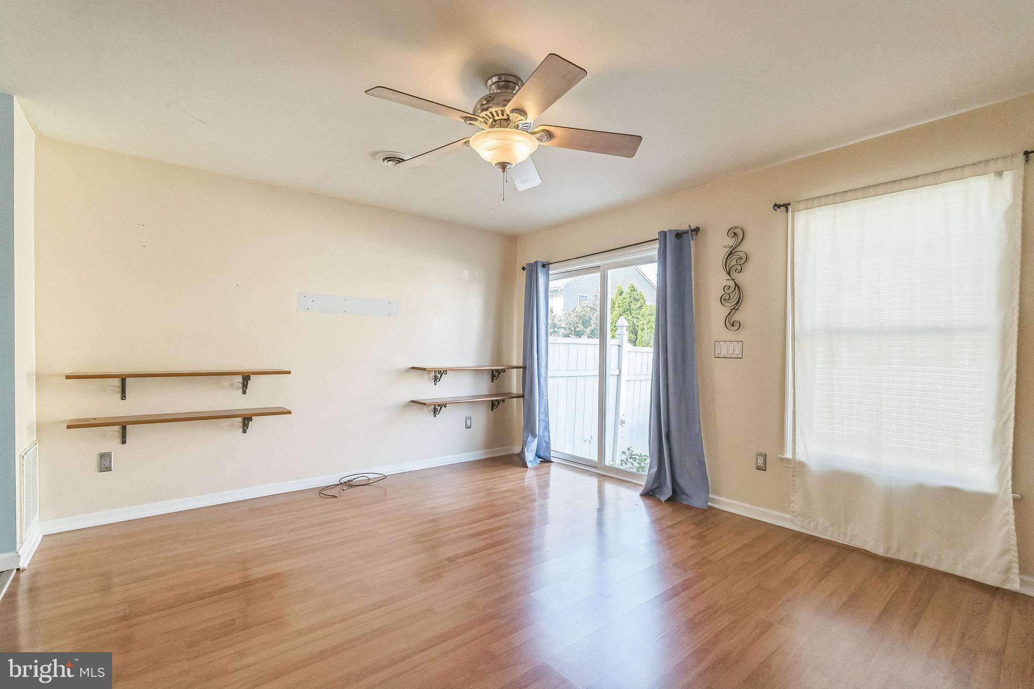 3566 Edgemont Street Philadelphia, PA 19134 - Photo 12 of 25 wooden floor in an empty room with a window