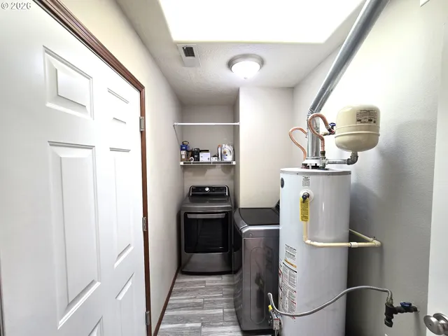 a kitchen with a refrigerator and cabinets