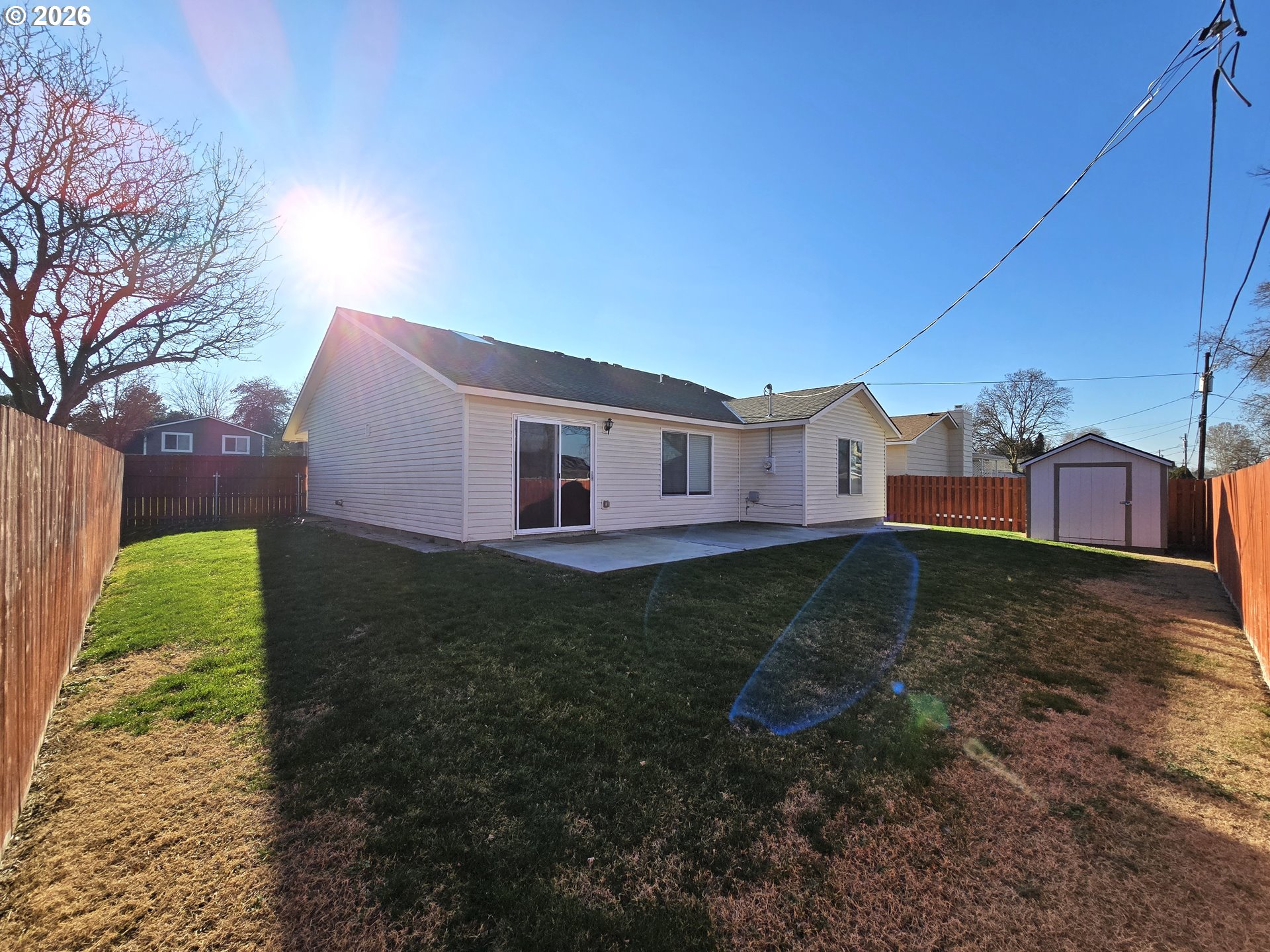 240 West Moore Avenue Hermiston, OR 97838 - Photo 16 of 19 a view of a backyard with a garden
