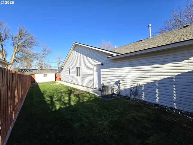 a view of a backyard with plants