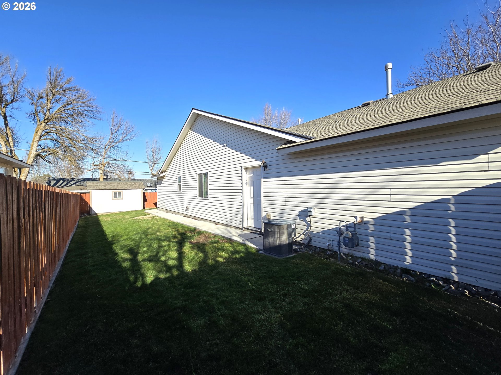240 West Moore Avenue Hermiston, OR 97838 - Photo 19 of 19 a view of a backyard with plants