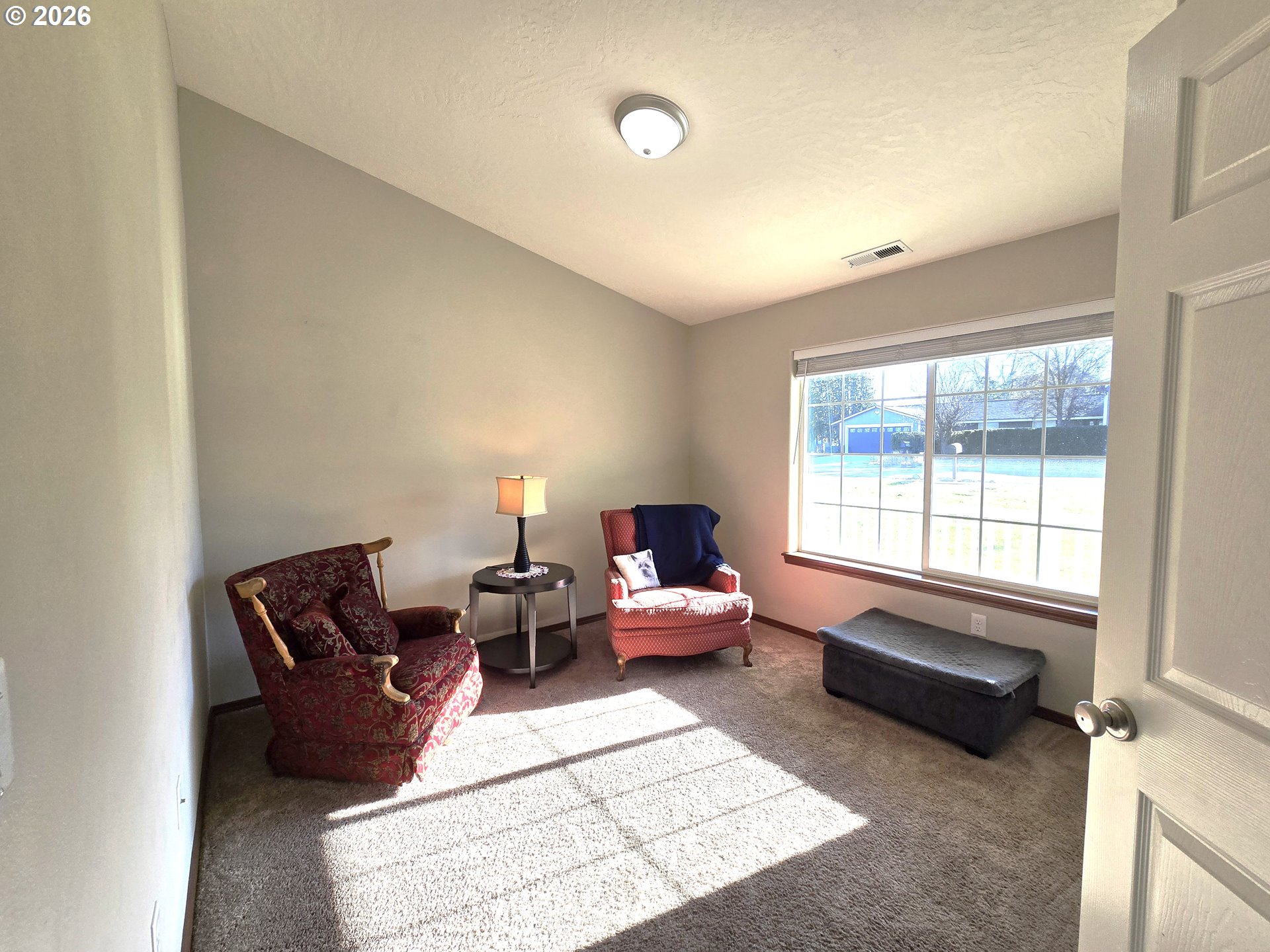 240 West Moore Avenue Hermiston, OR 97838 - Photo 7 of 19 a living room with furniture and a window