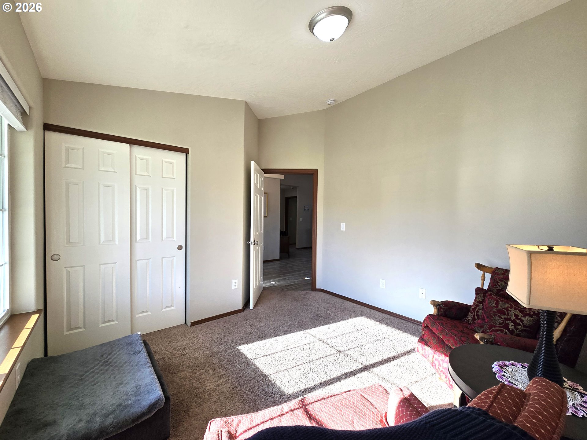 240 West Moore Avenue Hermiston, OR 97838 - Photo 8 of 19 a bed room with a bed and a couch